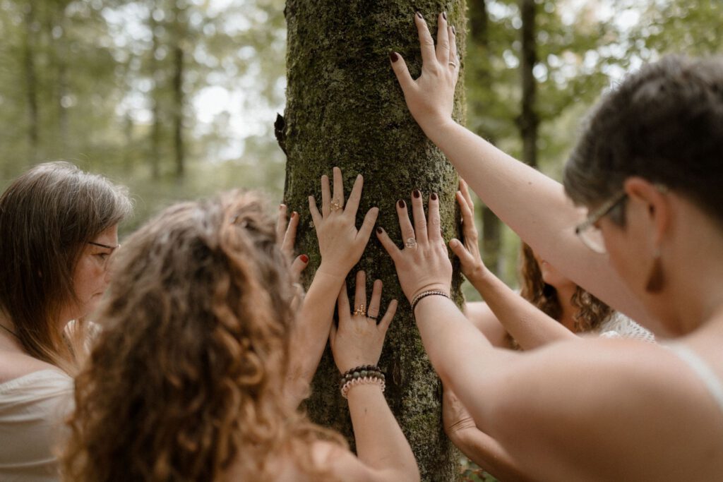 Women touching tree